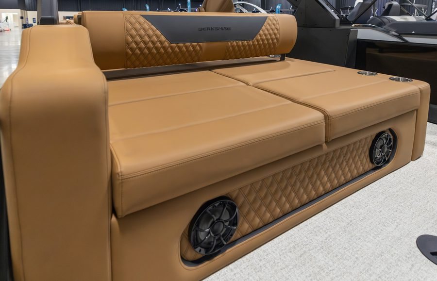 Berkshire pontoon tan luxury bench seating with stitching and speaker detail