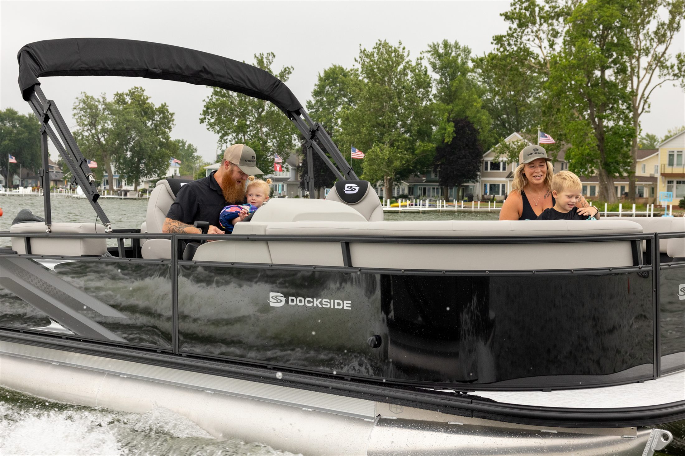 Dockside pontoon carrying a family across the lake