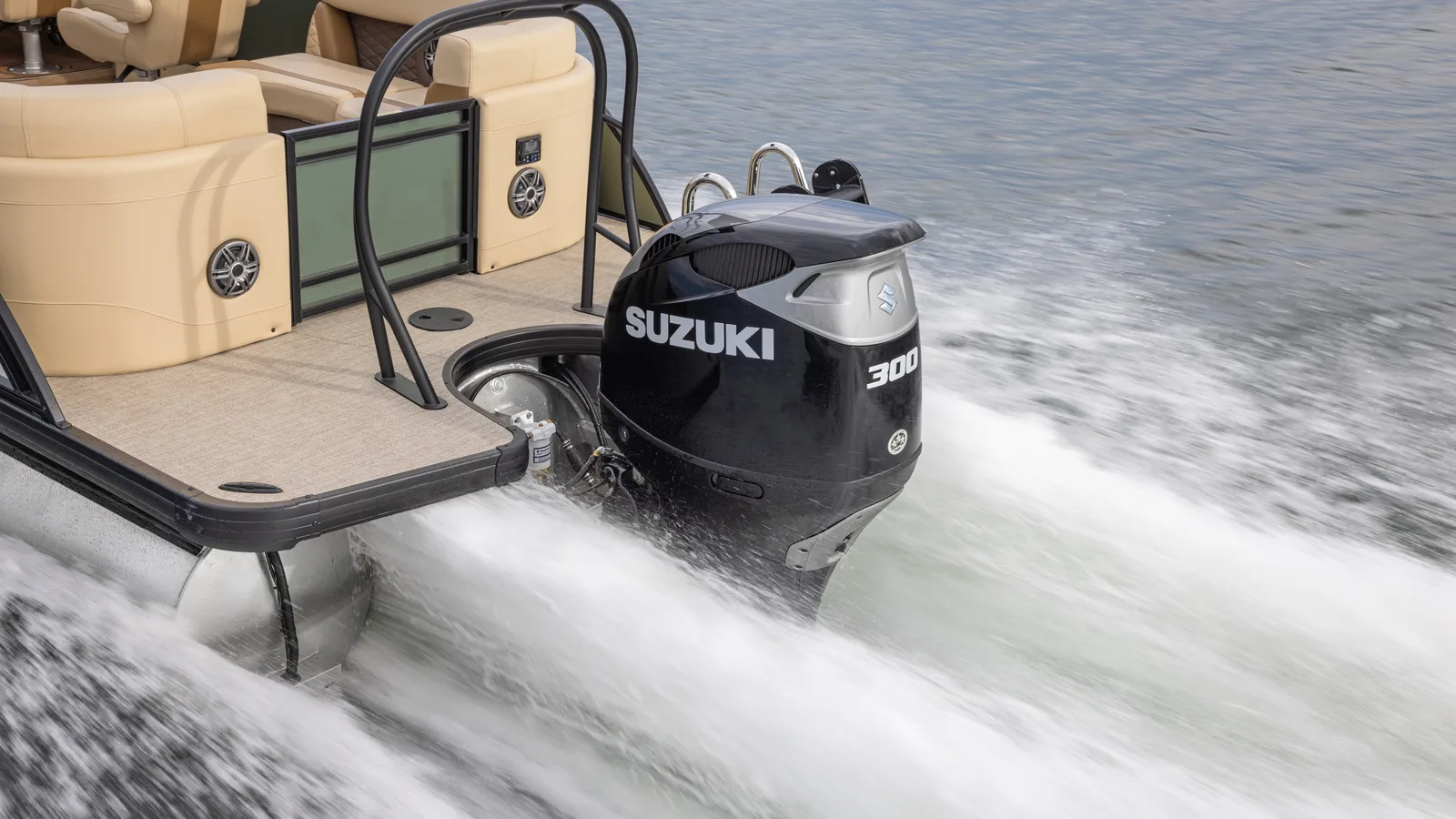 Suzuki outboard powering a pontoon on the water